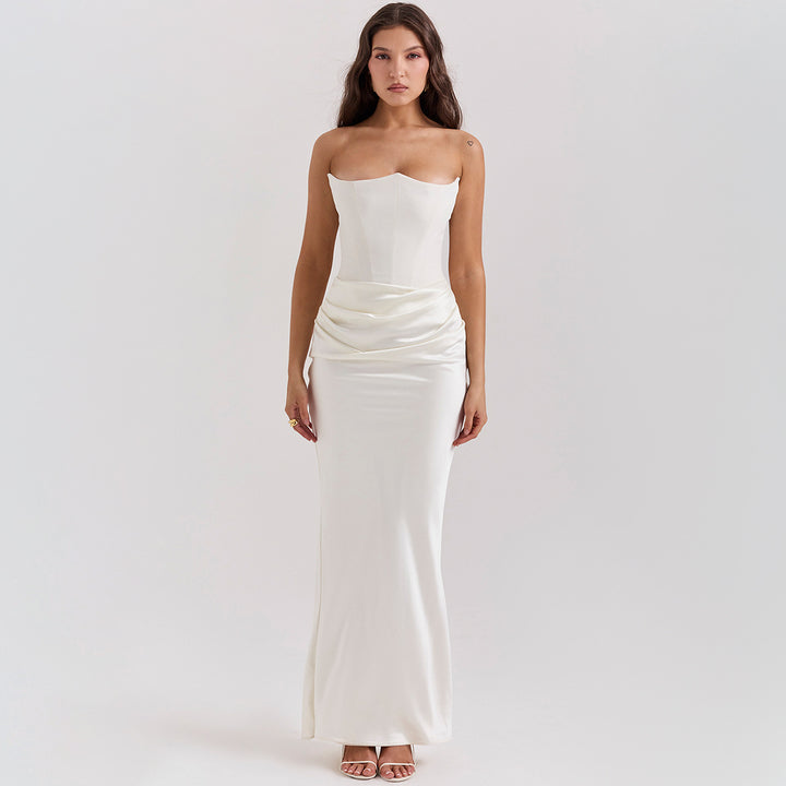 Woman in a strapless satin maxi gown