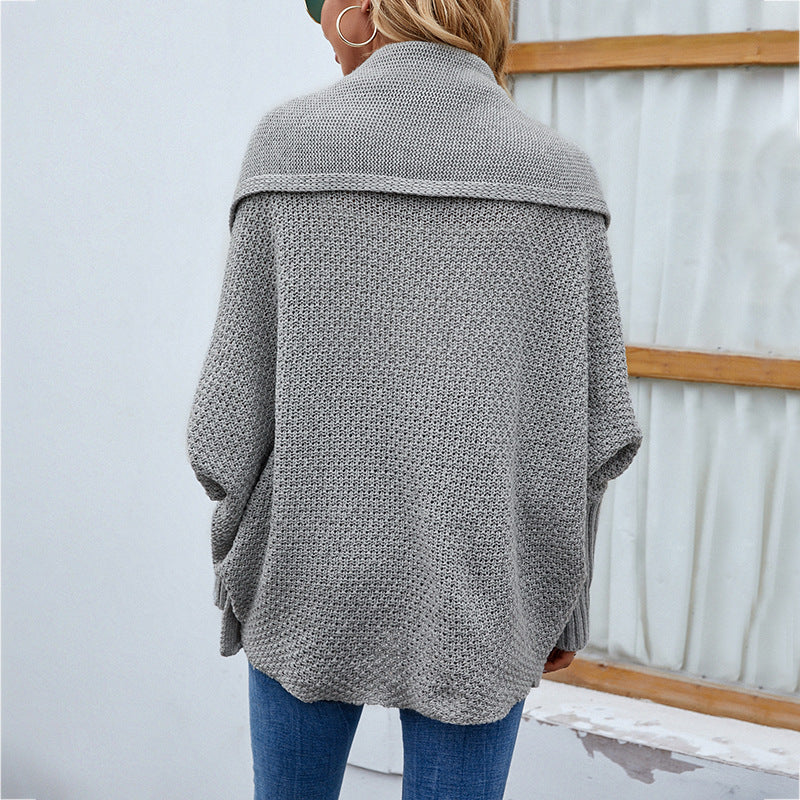 Woman in oversized batwing knit cardigan