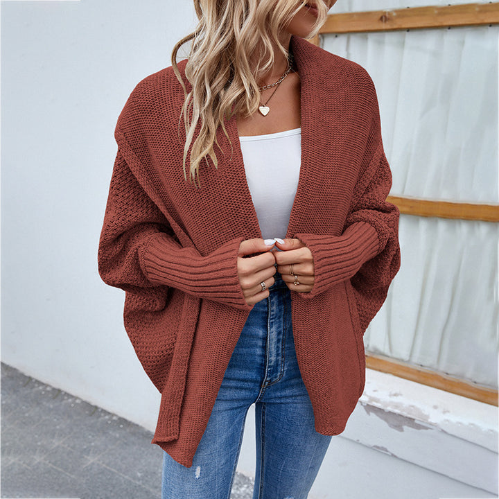Woman in oversized batwing knit cardigan