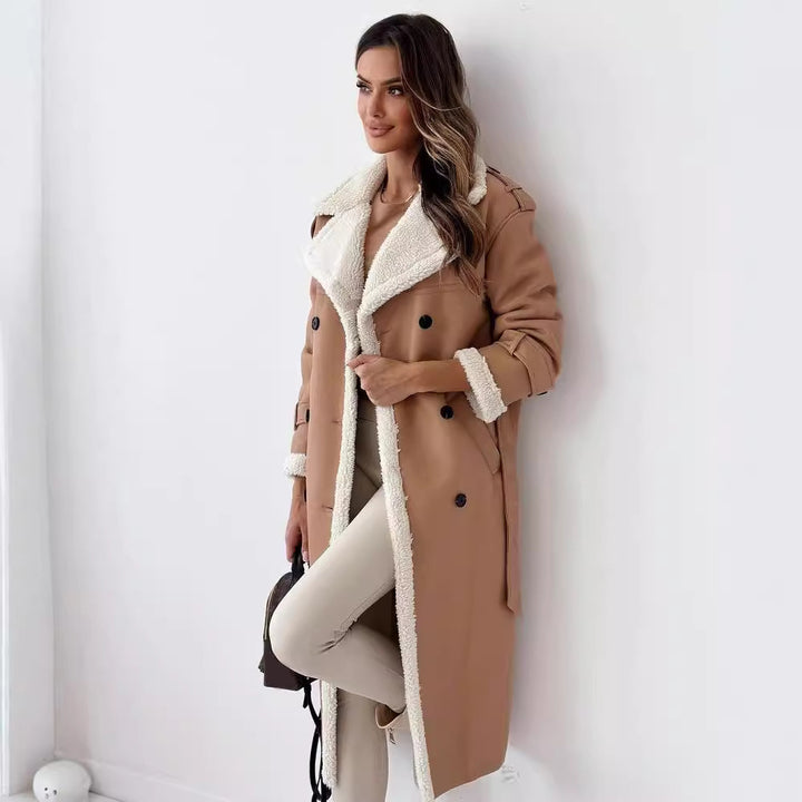 Woman in a belted faux shearling coat