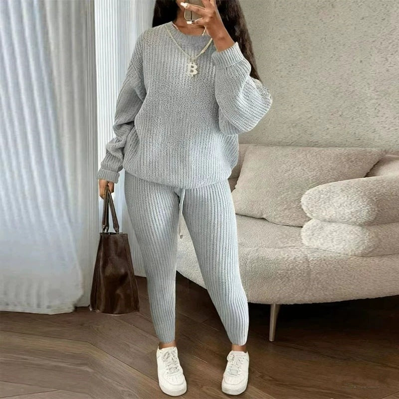 Woman in matching ribbed knit sweater and pants set