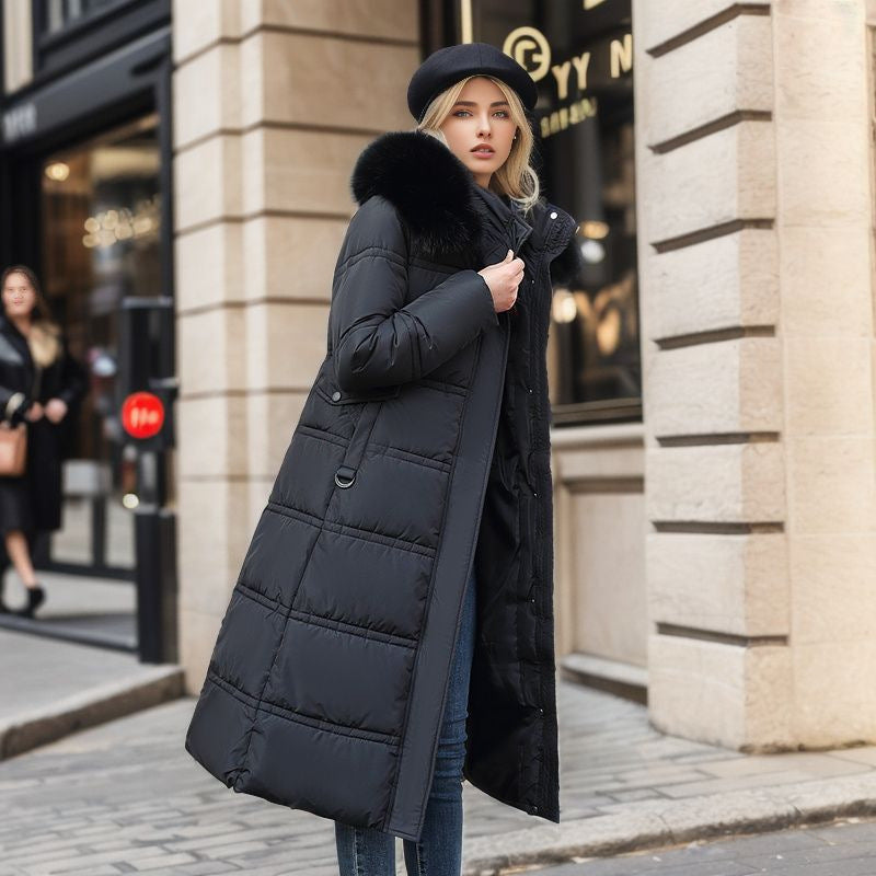 Woman in a long parka with fur hood